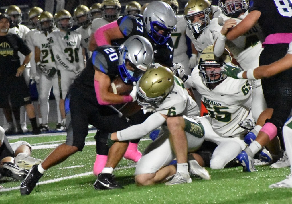 HUSKIES SHOCK SPARTANS